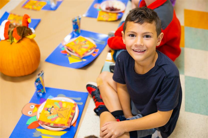 Students eat a Thanksgiving snack